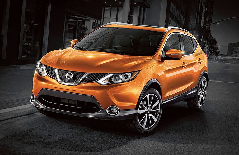 yellow orange SUV on dark background