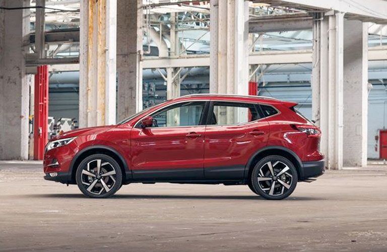 side view of a red 2020 Nissan Rogue