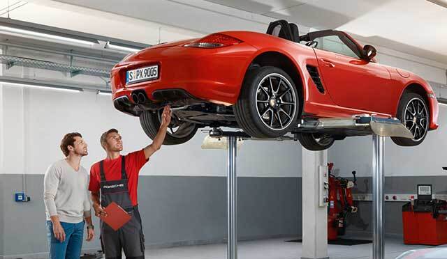 A mechanic working on a Porsche in , WI