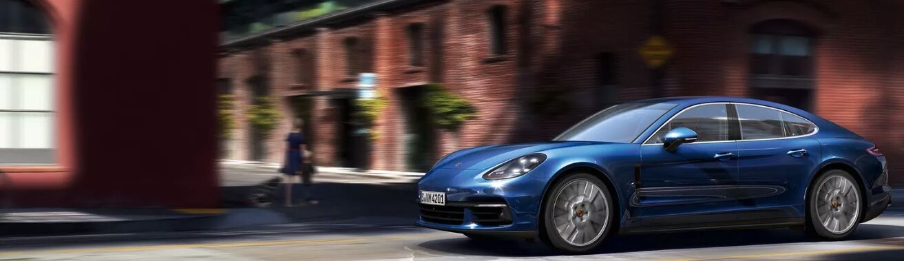 blue Porsche Panamera on city street