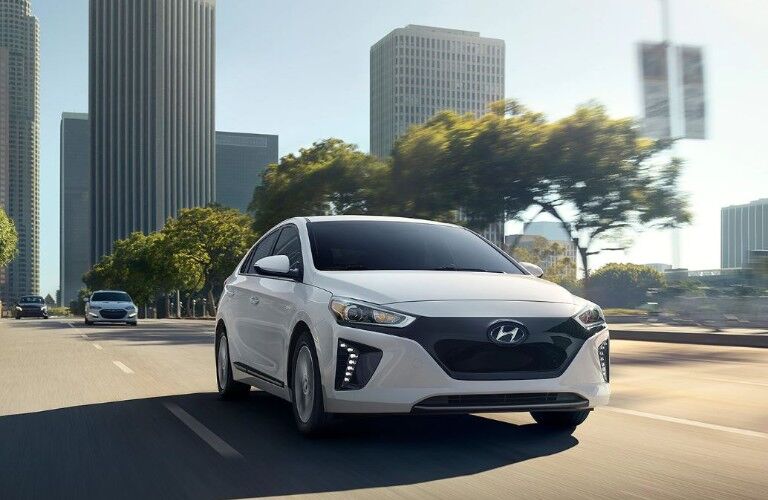 front of a white 2019 Hyundai Ioniq Electric