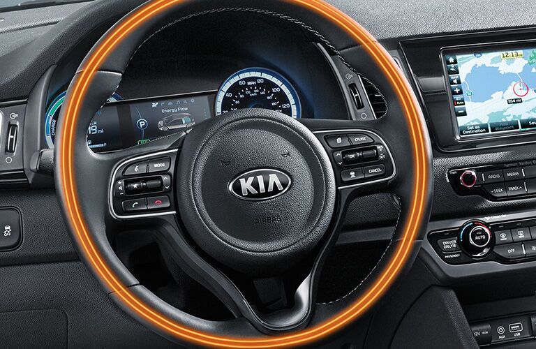 Isolated view of 2018 Kia Niro steering wheel with heating system highlighted