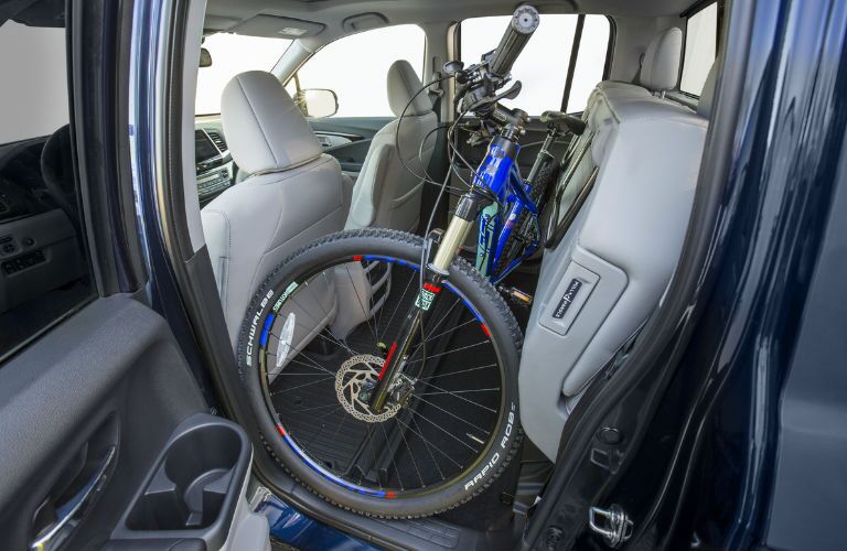 Ridgeline folding rear seat
