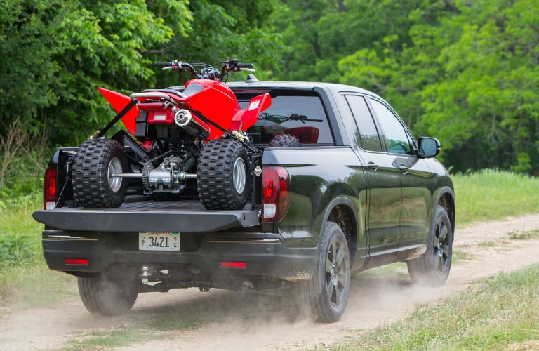 Ridgeline hauling 4-wheeler