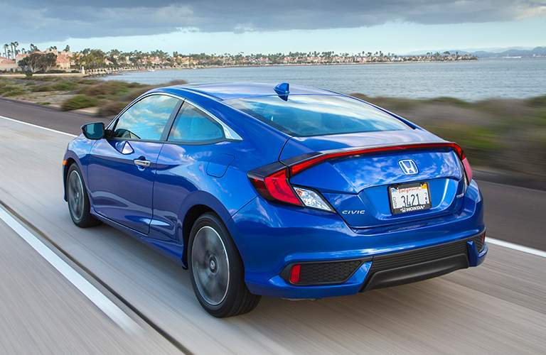 Blue 2018 Honda Civic Hatchback on a Coast Road