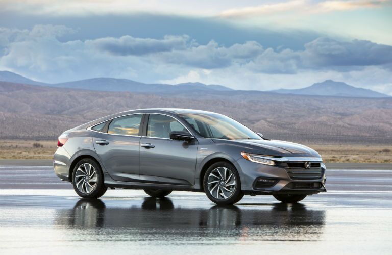 2019 Honda Insight parked on wet pavement in the desert