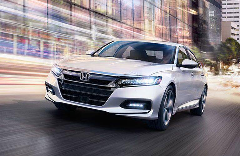 2018 Honda Accord driving downtown with streaking lights