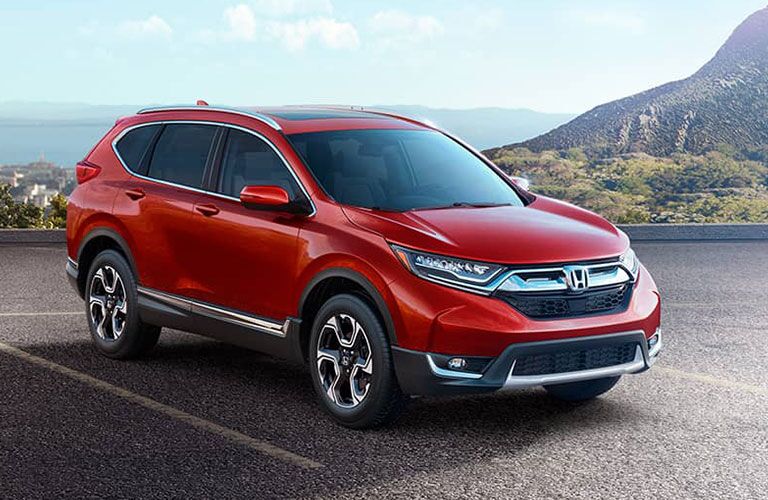 2018 Honda CR-V parked in a park lot near some water