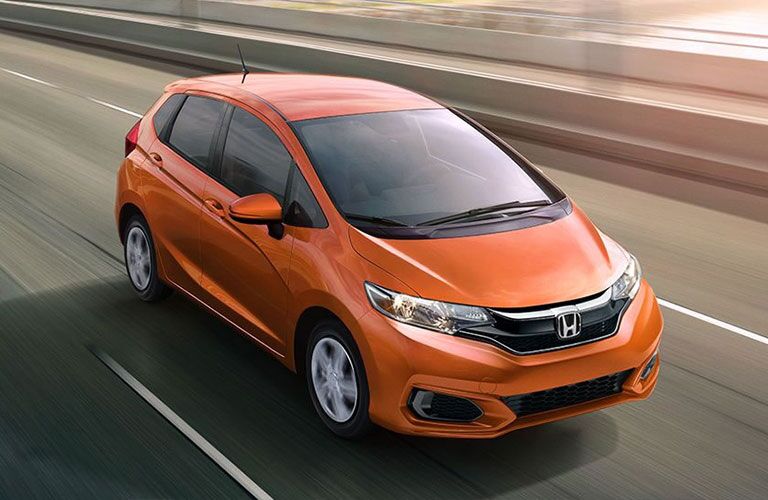 2018 Honda Fit in orange driving fast