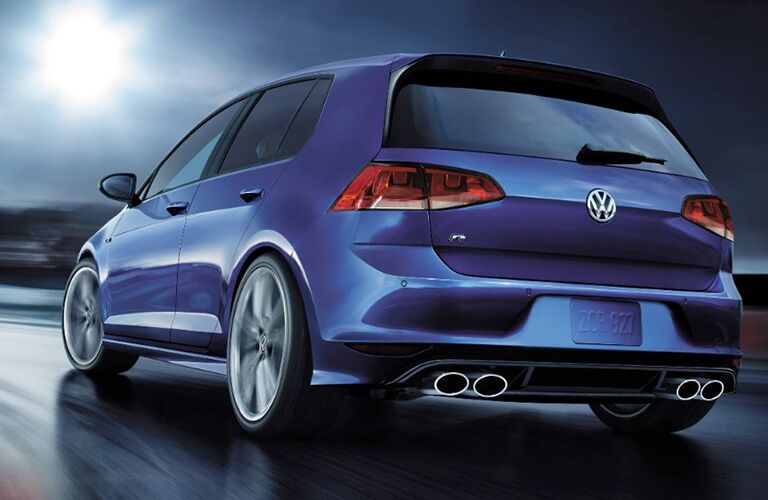 Blue 2018 Volkswagen Golf R driving on the highway at night