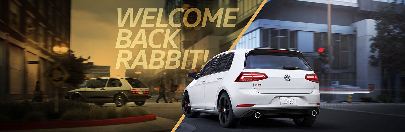 A 2019 Volkswagen Golf GTI Rabbit Edition drives down a city street with the text "Welcome Back Rabbit!" above it