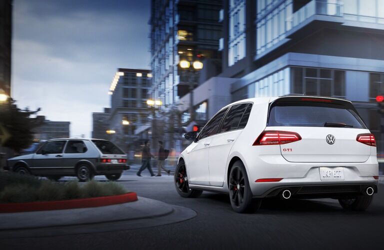 2019 Volkswagen Golf GTI Rabbit Edition driving down a city street