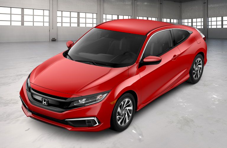 Red 2020 Honda Civic Coupe in a Garage