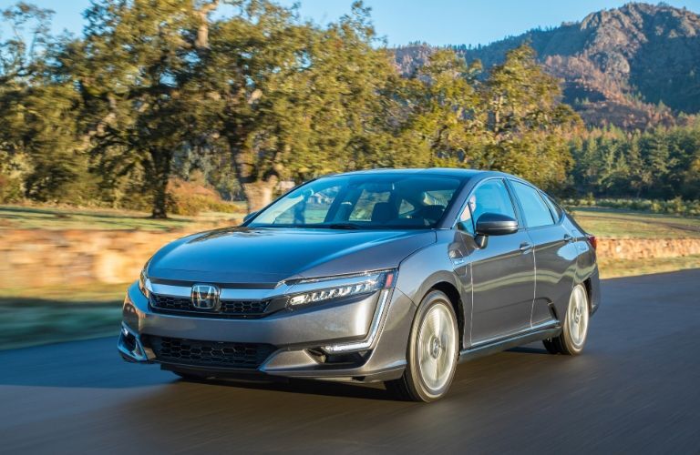 Gray 2020 Honda Clarity Plug-In Hybrid on a Country Highway