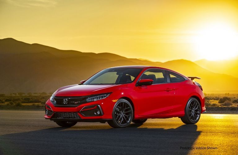 Red 2020 Honda Civic Si Coupe at Sunset with Black Prototype Vehicle Shown Text in Lower Right Corner
