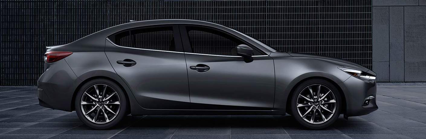 Passenger side exterior view of a grey 2018 Mazda CX-3
