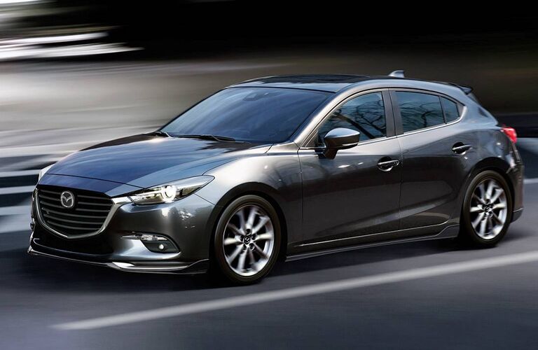 2018 Mazda3 5-Door driving fast with background blurring