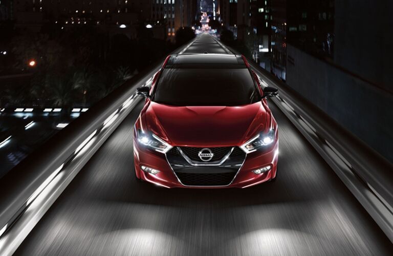 2018 Nissan Maxima driving on narrow bridge in a city
