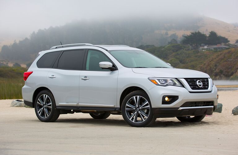 2018 Nissan Pathfinder parked on sand in rural area