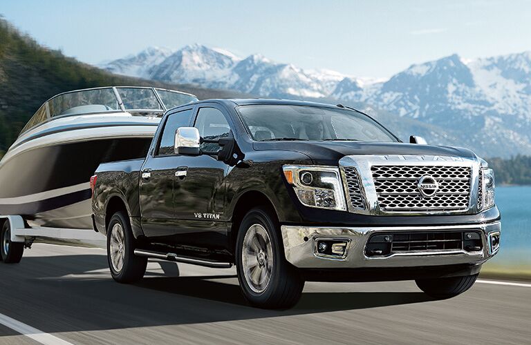 2018 Nissan TITAN pulling a boat by mountains