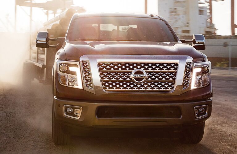 2018 Nissan TITAN XD towing pipes at a work site