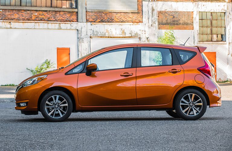 2018 Nissan Versa Note parked by an old building