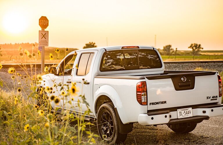 Rear view of white 2019 Nissan Frontier