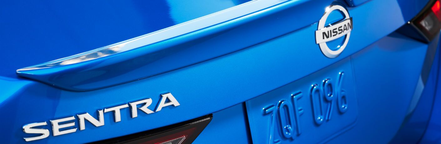 A photo of the Sentra and Nissan badges used on the back of the 2020 Nissan Sentra.