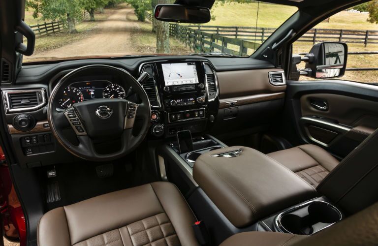 A photo of the dashboard and driver's cockpit in the 2020 Titan XD.