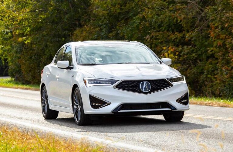 Passenger's side front angle view of white 2020 Acura ILX