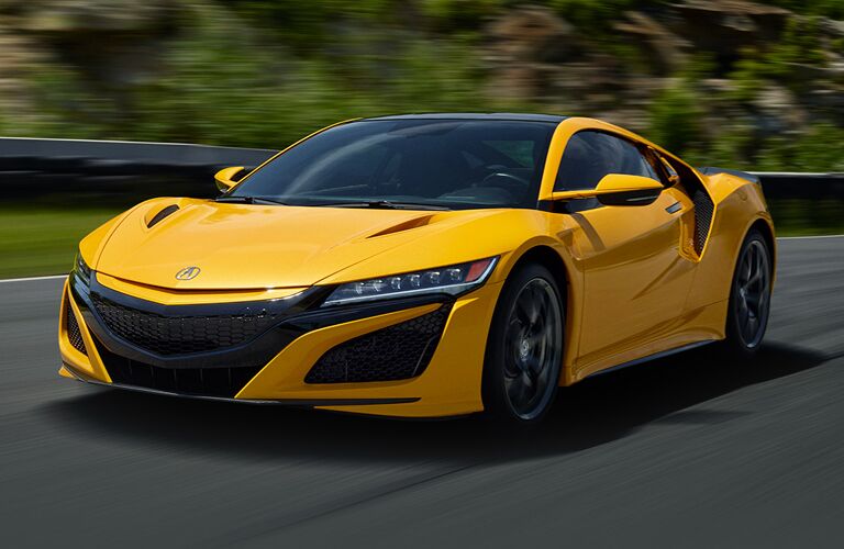 Driver's side front angle view of yellow 2020 Acura NSX