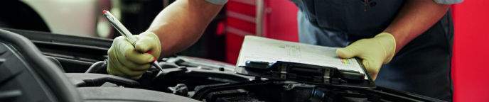 Toyota Technician Checking Engine Bay