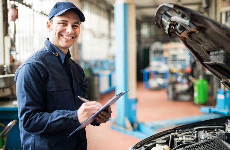 service technician working on vehicle