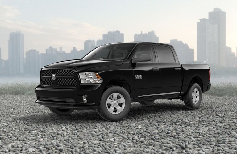 2018 Ram 1500 Front View of Black Exterior with City Skyline Behind it