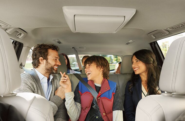 family sitting in the rear seats of the 2018 Toyota Highlander