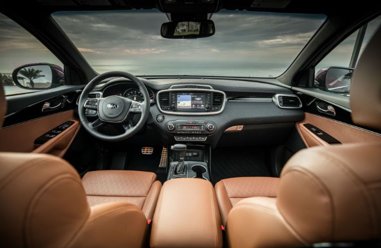 A photo of the dashboard and front seats in the 2019 Kia Sorento.