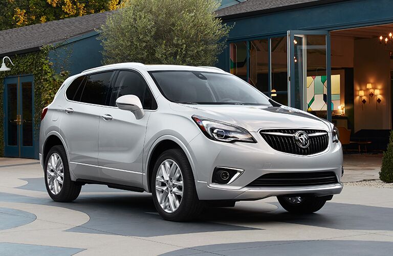 2019 Buick Envision exterior shot parked outside a street with cafes and local shops