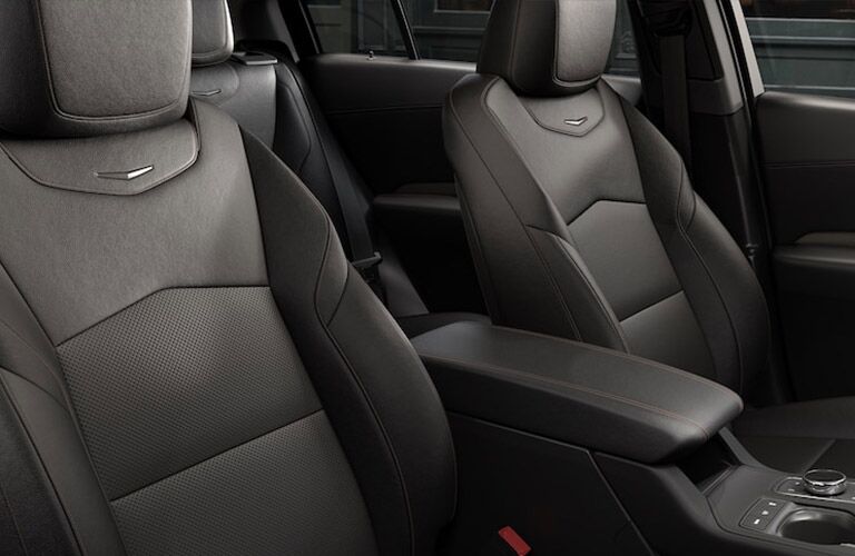 2019 Cadillac XT4 interior shot of front seating leather upholstery and Cadillac badge stitching