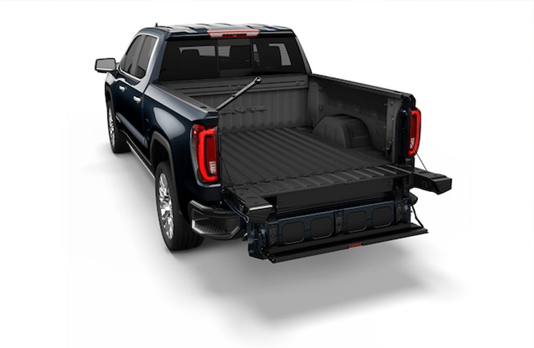 2019 GMC Sierra 1500 exterior rear shot of the multi-pro tailgate functions in use