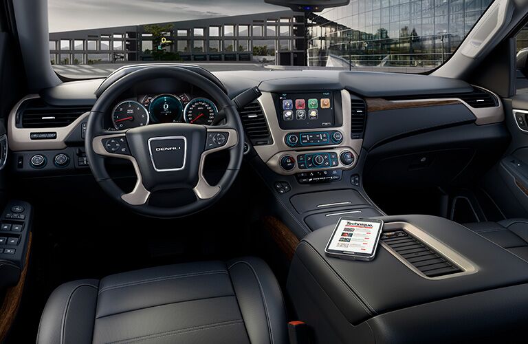 2019 GMC Yukon Denali interior shot of front seating and dashboard layout