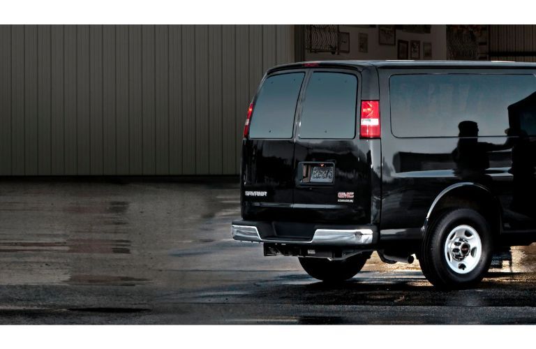 2020 GMC Savana Passenger van exterior shot of rear doors with black paint color