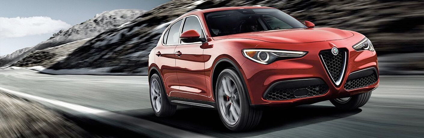 front and side view of red 2019 alfa romeo stelvio