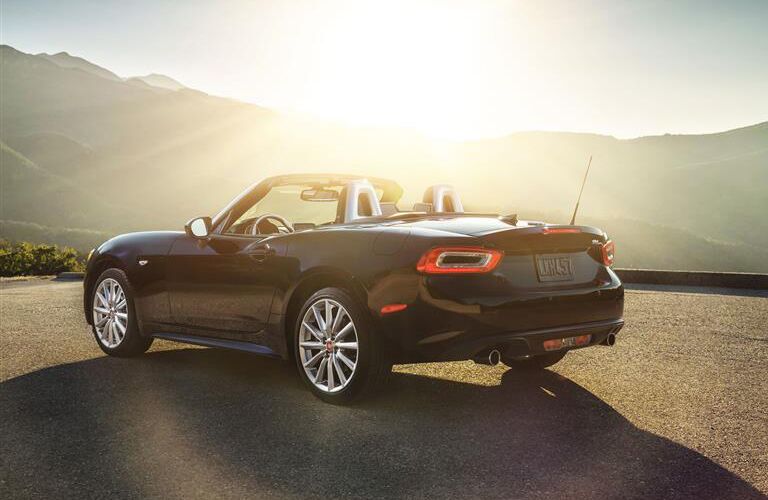 rear and side view of black 2019 fiat 124 spider
