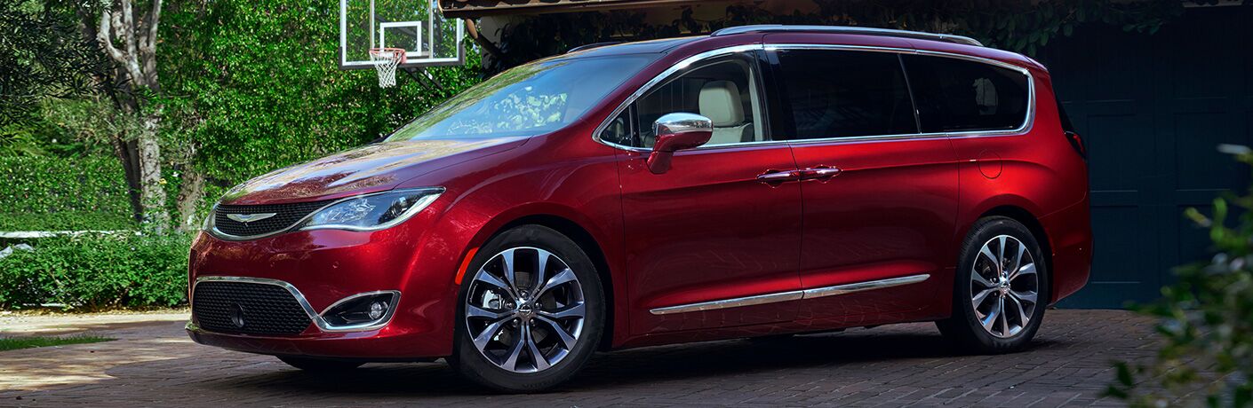 red 2019 chrysler pacifica parked in driveway
