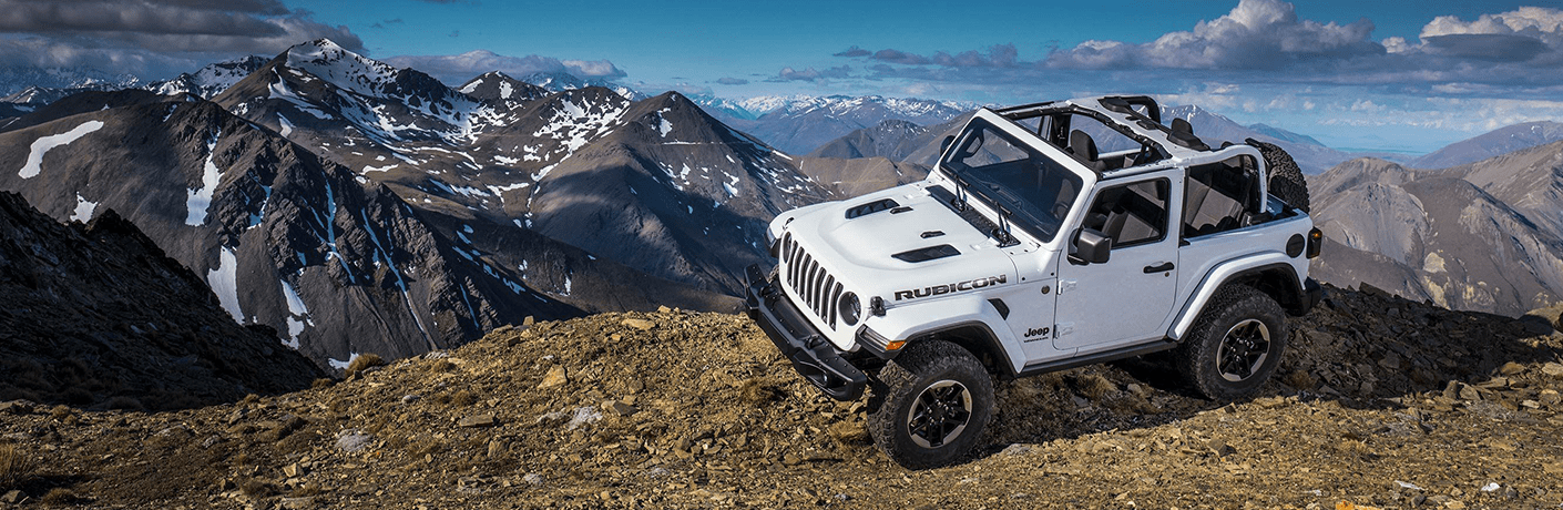 White 2019 Jeep Wrangler overlooking mountains
