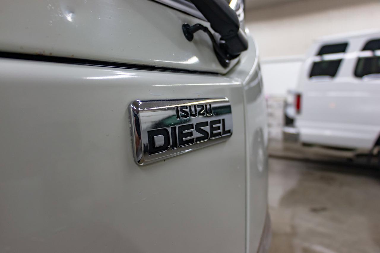 2011 Isuzu NPR HD 2 Door Tilt Cab Deck Diesel Red Deer AB