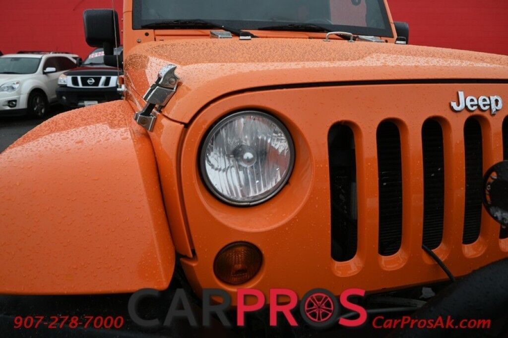2012 Jeep Wrangler Unlimited Sahara - 4X4 - Automatic - Paint Matched Hardtop - Remote Start - Heated Leather Seats - Keyless Entry - Infinity Sound System - Navigation - Bluetooth - American Outlaw Wheels - Tow Pkg Anchorage AK