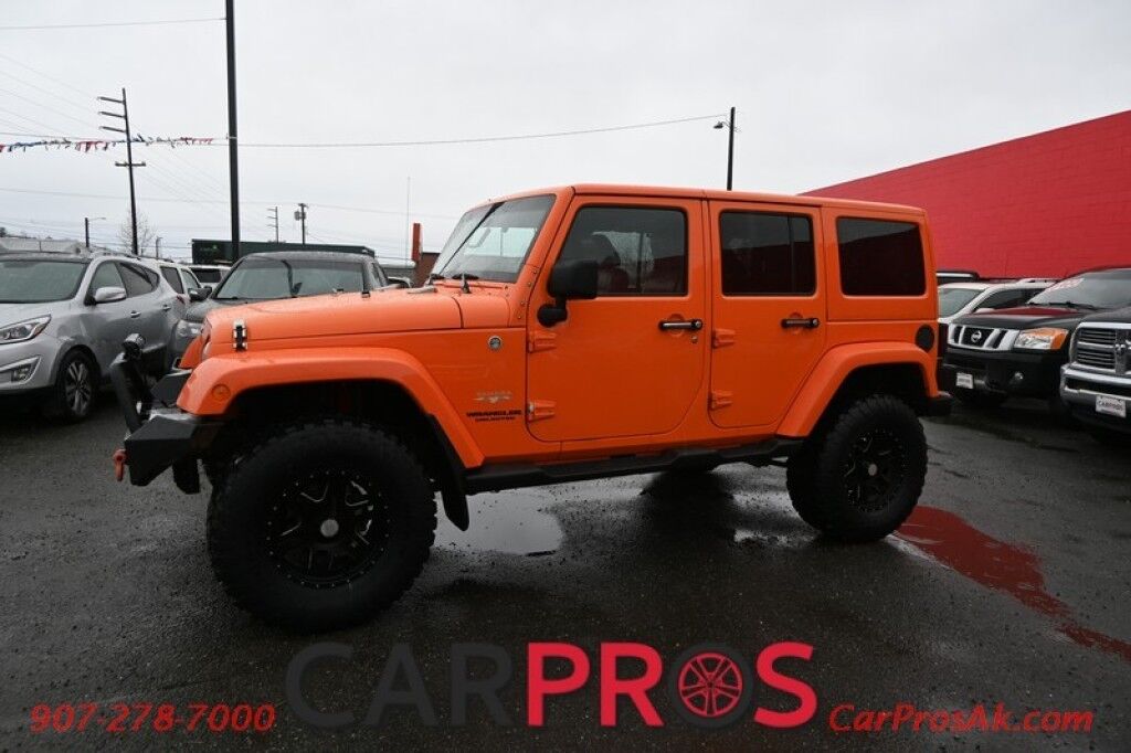 2012 Jeep Wrangler Unlimited Sahara - 4X4 - Heated Leather Seats - Remote Start - Power WIndows & Locks - Keyless Entry - Infinty Sound System - NAV - Bluetooth - Winch Ready Bumper w/ 20 Lightbar - Color Matched Hard Top - American Outlaw Wheels - Tow Pkg