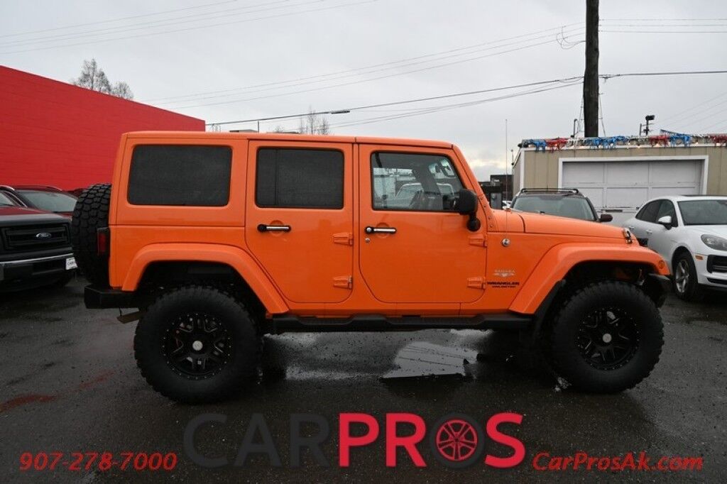 2012 Jeep Wrangler Unlimited Sahara - 4X4 - Heated Leather Seats - Remote Start - Power WIndows & Locks - Keyless Entry - Infinty Sound System - NAV - Bluetooth - Winch Ready Bumper w/ 20 Lightbar - Color Matched Hard Top - American Outlaw Wheels - Tow Pkg Anchorage AK