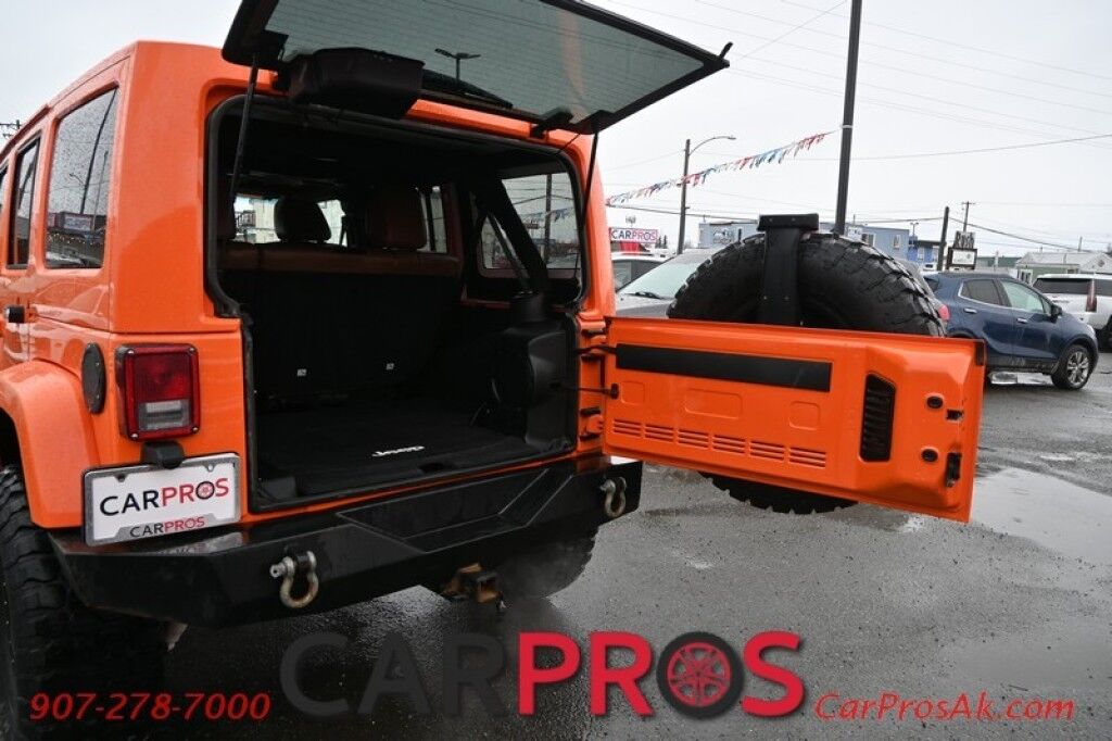 2012 Jeep Wrangler Unlimited Sahara - 4x4 - Remote Start - 3.6L V6 - Leather & Heated Seats - Power WIndows & Locks - Keyless Entry - Infinty Sound System - NAV - Bluetooth - Winch Ready Bumper w/ 20 Lightbar - Color Matched Hard Top - American Outlaw Wheels - Tow Pkg Anchorage AK